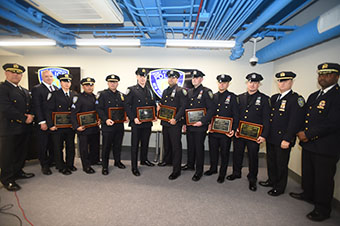 The eight officers joined by Chiefs Gonzalez and Brown and Commissioner Green